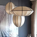 Zen Silk Pendant Light Mid Century Fabric Lantern in elegant sculptural form, enhancing modern interiors with warm illumination.