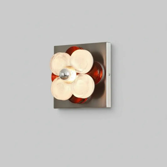 hero Modern wall light fixture with glass shades on a neutral background