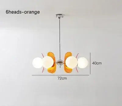 Rare Mid-Century Orange Plexiglass Chandelier: A Unique Vintage Gem showcasing its oval reflectors and frosted glass balls.