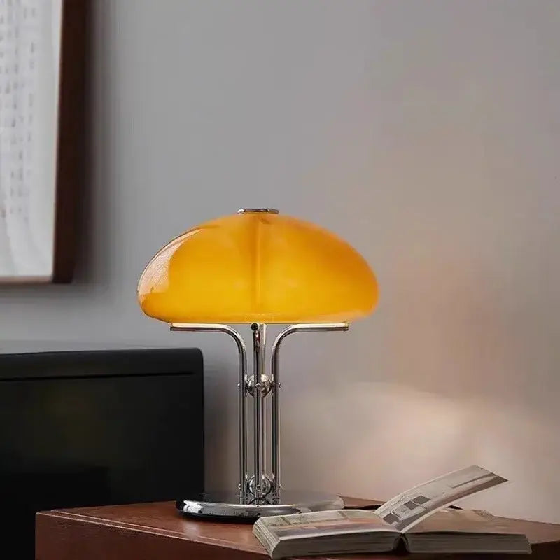 Yellow table lamp on a wooden surface with a blurred background