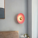 Colourful 30 cm Modern Circle Wall Light with Gold illuminating a contemporary room.