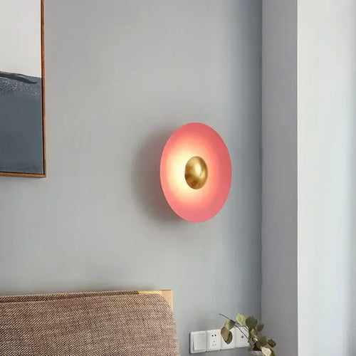 Colourful 30 cm Modern Circle Wall Light with Gold illuminating a contemporary room.