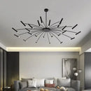 Modern Starburst LED Chandelier – 24-Light Sculptural Ceiling Statement in black finish illuminating a stylish living room.
