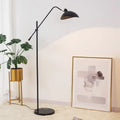 Marble Based 50s Floor Lamp in a stylish interior with a plant and artwork.