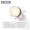 Futuristic and Unique Solid Plexiglass Wall Light in white, featuring a fluted design and LED light source.