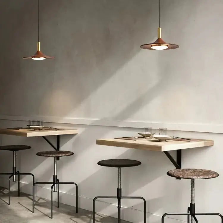 Walnut Mid Century Modern Chandelier in a minimalist dining setting with stylish seating.