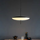 Nordic LED Pebble Pendant Light – Minimalist Ceiling Lamp hanging over a stylish dining table with sleek decor.