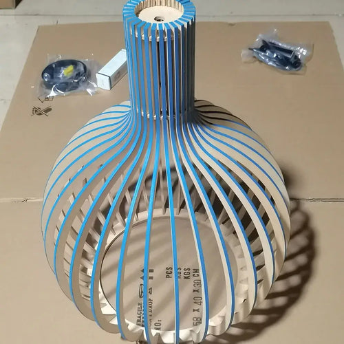 Nordic Retro Modern Wood Cage Pendant showcasing a unique wood design with blue accents and high-quality materials.