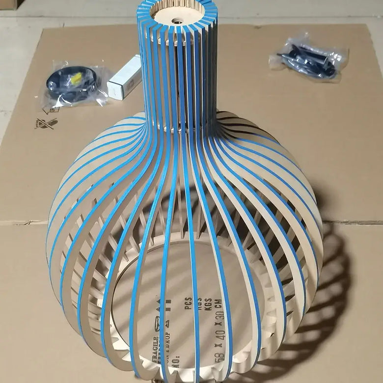 Nordic Retro Modern Wood Cage Pendant showcasing a unique wood design with blue accents and high-quality materials.