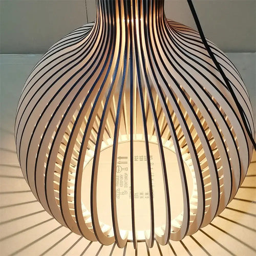 Nordic Retro Modern Wood Cage Pendant showcasing unique design and elegant lighting in a contemporary style.