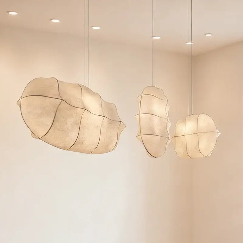 Japanese Wabi-Sabi Silk Pendant Light – Sculptural White Hanging Lamp in a serene setting.