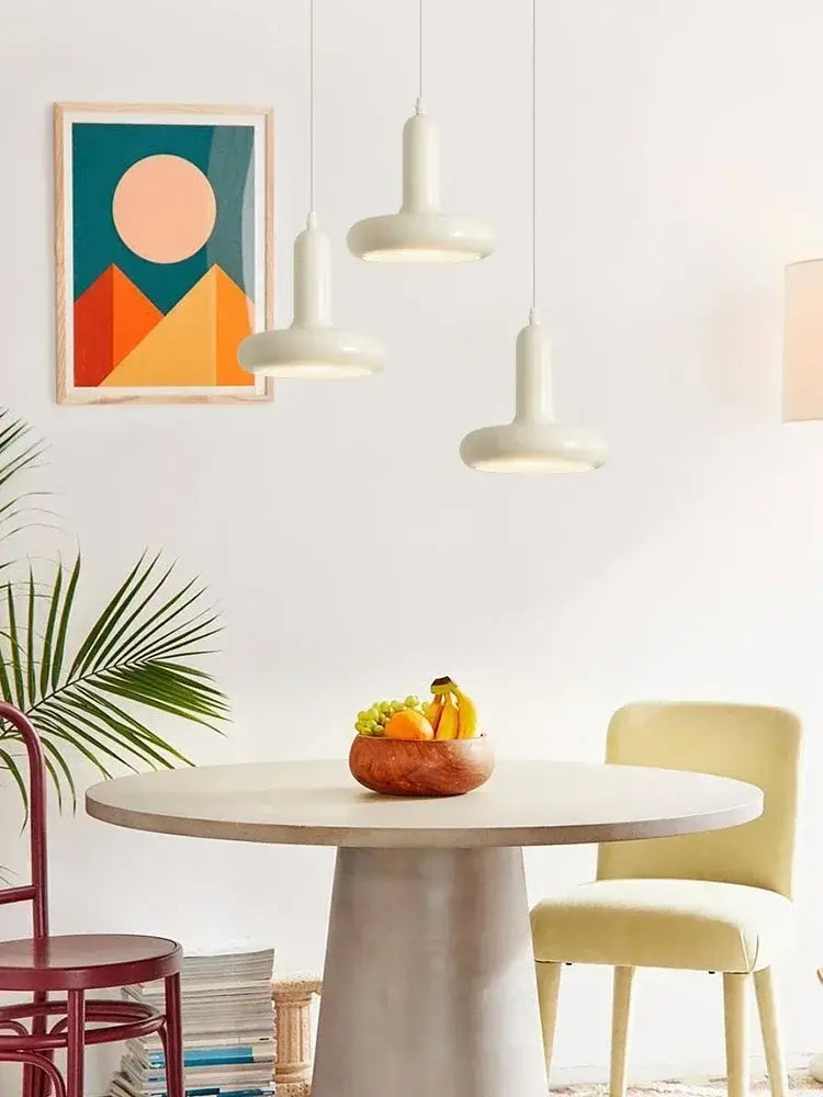 60s Scandinavian Style Kitchen Pendant Lamp above a modern dining table with a fruit bowl and stylish decor.