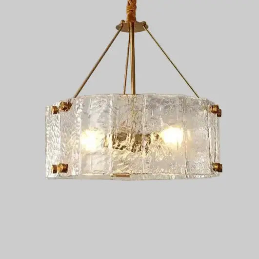 Textured Glass Crystal Pendant Light with Gold Frame illuminating a stylish interior space.