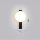 Modern Simple Art Deco Revival Wall Lamp showcasing dimensions and design with round light and sleek black structure.