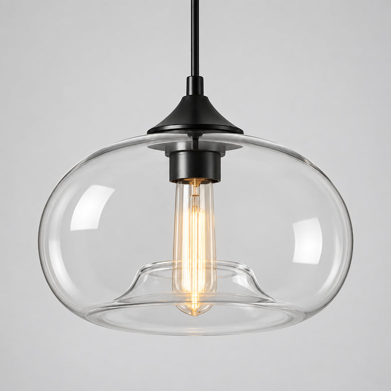 Nordic minimalist glass dome pendant light with a black cable and ceiling plate on a neutral wall