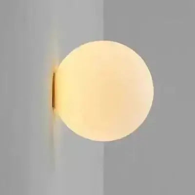 hero Round wall light fixture on a gray wall
