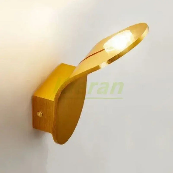 Wall Lamp: Mid-Century Modern Japanese Style in a sleek gold finish, featuring a leaf-inspired design.