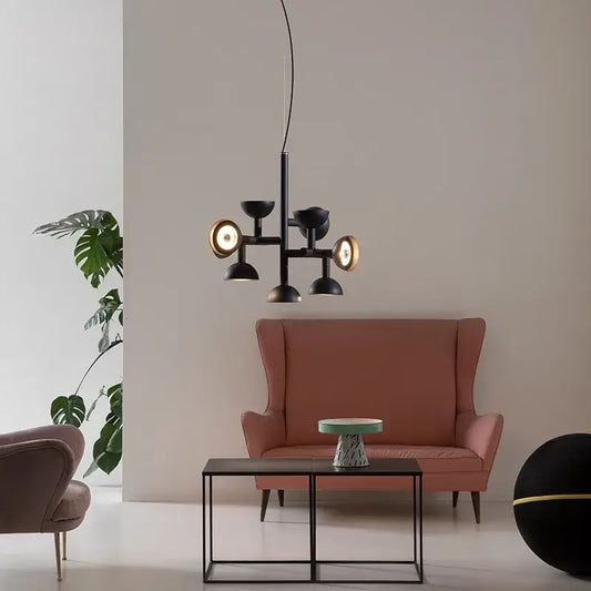 Danish Postmodern LED Chandelier – Sculptural Black Designer Pendant Light illuminating a chic living room setting.