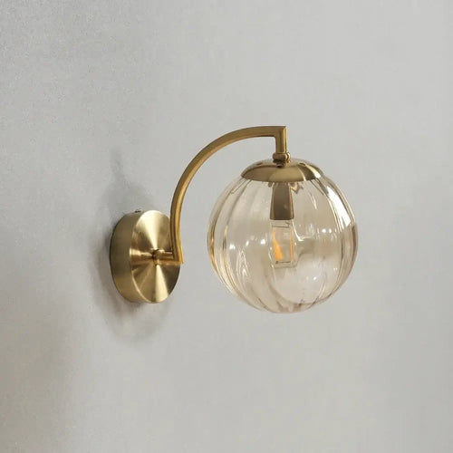 Colourful Glass Modern Wall Light with golden metal base and transparent colorful bulb for stylish decor.