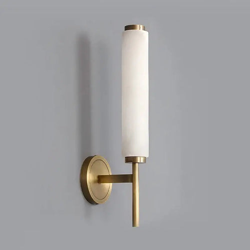 Stylish Art Deco Brass Wall Lamp with frosted glass, adding elegance and warm illumination to any space.