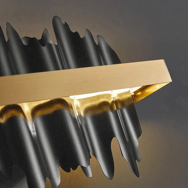 Striking Black and Gold Wall Lamp showcasing a modern design with captivating lighting effects.