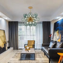 Glorious Tinted Glass Bubble Chandelier illuminating a modern living room with artistic decor.
