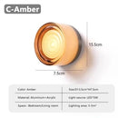 Futuristic and Unique Solid Plexiglass Wall Light shown in amber color, designed for bedroom and living room use.