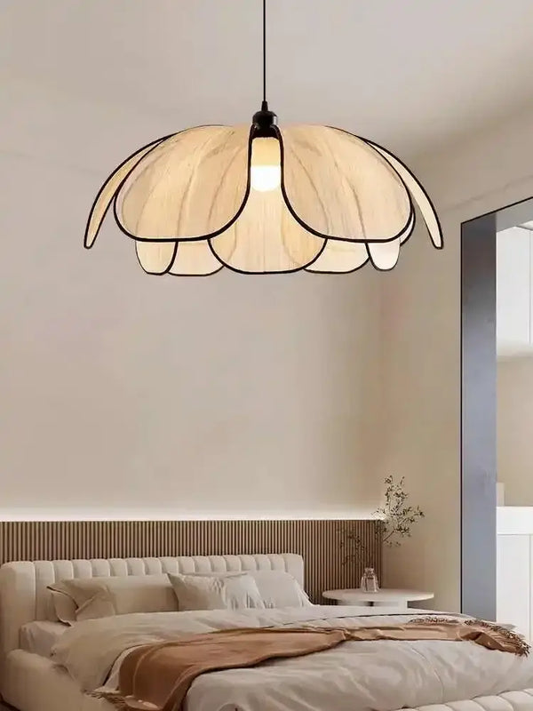 Black and White Rattan Flower Lamp Shade illuminating a stylish bedroom with a minimalist aesthetic.