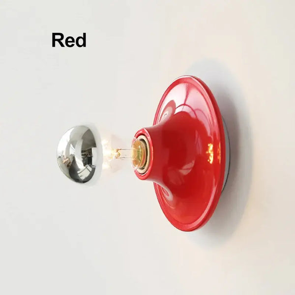 80s revival wall light in vibrant red UFO shape with silver bulb, perfect for adding retro style to any room.