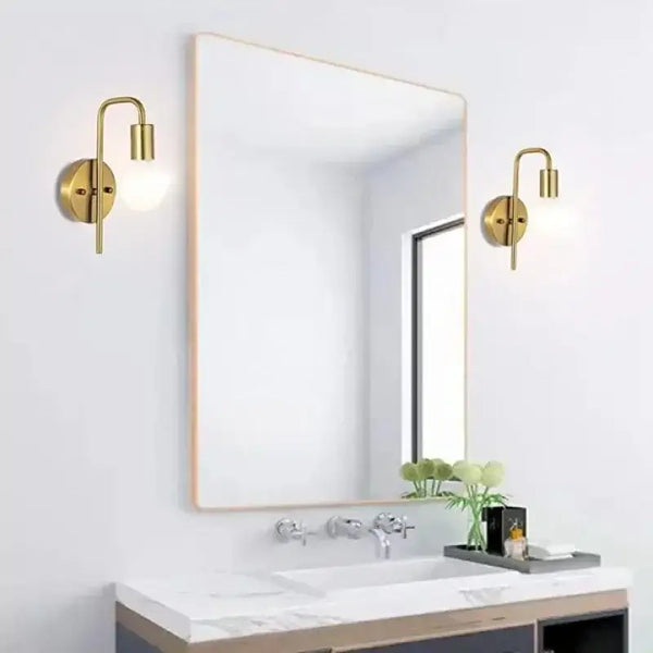 Nordic Bend Pipe Wall Lamp – Sleek Gold or Black Iron Lighting Fixture installed in modern bathroom setting.