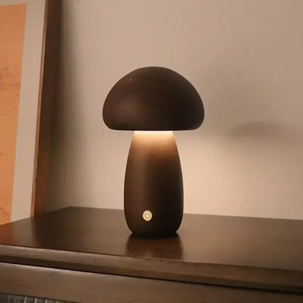 Portable Dimmable 60s Italy Designer Mushroom Table Lamp illuminating a room on a wooden surface.