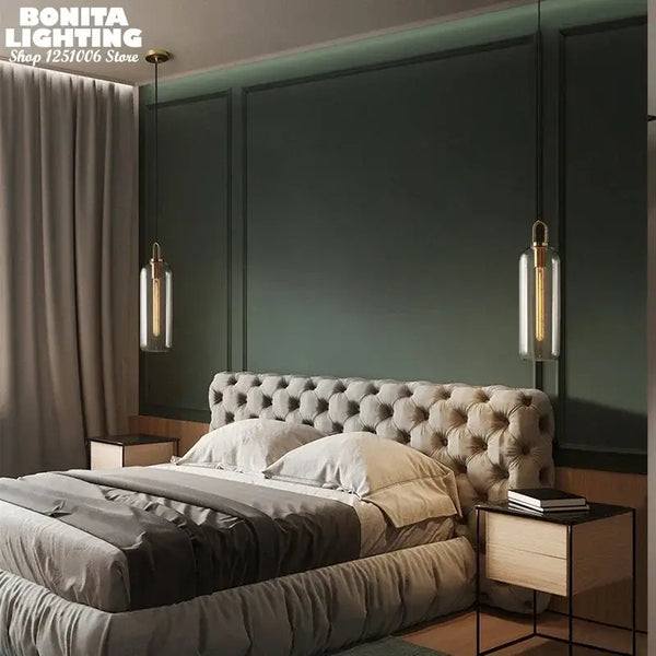 Grey Frosted Sphere Glass Hanging Lamp illuminating a modern bedroom with tufted bed and stylish decor.