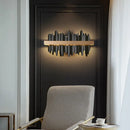 Striking Black and Gold Wall Lamp illuminating a modern interior, enhancing sophisticated design with luxe materials.