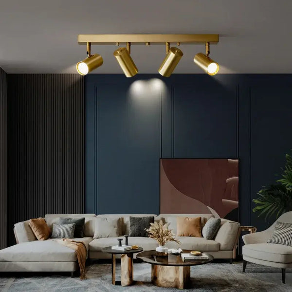 Gold Nordic Minimalist LED Spotlight Ceiling Light featuring three stylish spotlight heads in a modern living room setting.