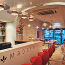 Classic Nordic Designer Pendant Lights Available in 3 different sizes hanging in a modern restaurant interior.