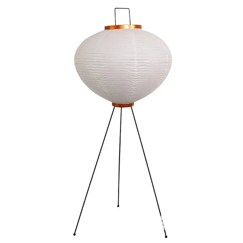 Japanese Rice Paper Lamp. White textured lampshade on a black tripod stand with a white background