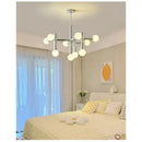 Bauhaus Chrome Chandelier – Modern 10/13 Globe Pendant Light illuminating a stylish bedroom with a cozy aesthetic.