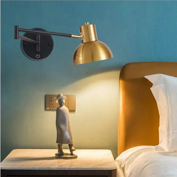 Vintage Loft Bedside Reading Light Fixture with gold shade illuminating a modern bedside table decor.