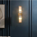 Bathroom Art Deco Brass and Crystal Sconces illuminating a stylish space with elegant lighting.