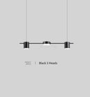 Hanging Minimalism Lights featuring a sleek design with three black heads, suitable for modern interiors.