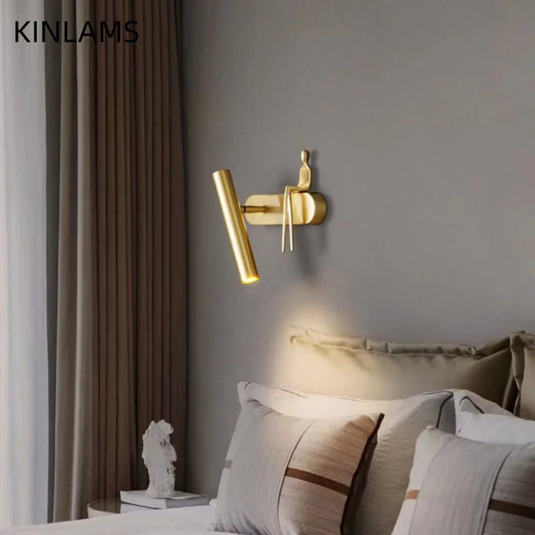 Minimalist Wall mounted Light with Seated human figure, Gold/Black