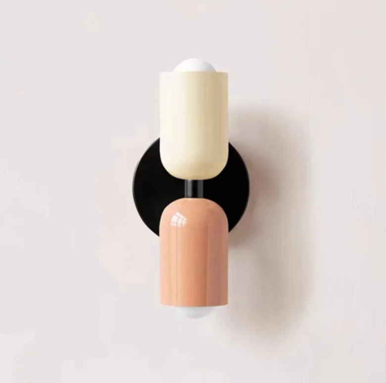 Hero Wall sconce with two-tone design on a light gray background