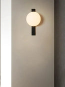 Minimalist Nordic Wall Lamp with Frosted White Ball on a wall, showcasing modern design and simple elegance.