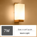 Wood and Frosted Glass Japanese Minimalist Sconces with warm light and size dimensions 11 cm x 25 cm.