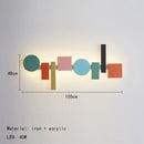 Multicolour Wall Totem LED geometric light displayed in modern design with vibrant colors and various shapes.