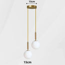 Modern Gold Glass Ball Pendant featuring sleek design with two white glass bulbs and adjustable golden suspension.