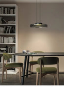 Layered Glass Pendant Light – Modern Amber, Green or Smoke Grey LED Suspension illuminating a dining table in a cozy setting.