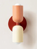 Classic Midcentury Modern Wall Lamp (10x25cm) with pink and cream shades on a round red base.