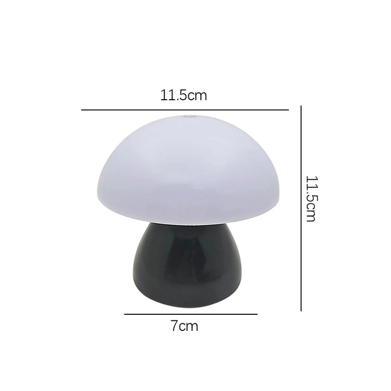 A mushroom-shaped table lamp with a white dome-shaped shade and a black base, shown with dimension lines and labels indicating 11.5cm width, 11.