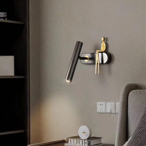 Minimalist Wall mounted Light with Seated human figure, Gold/Black